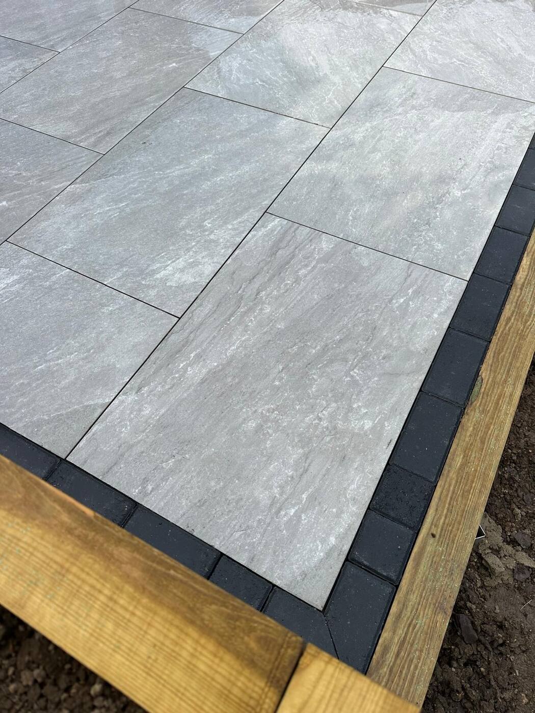Porcelain patio with raised sleeper beds