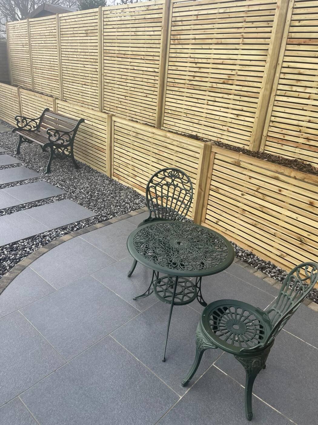New slatted fencing behind a porcelain patio